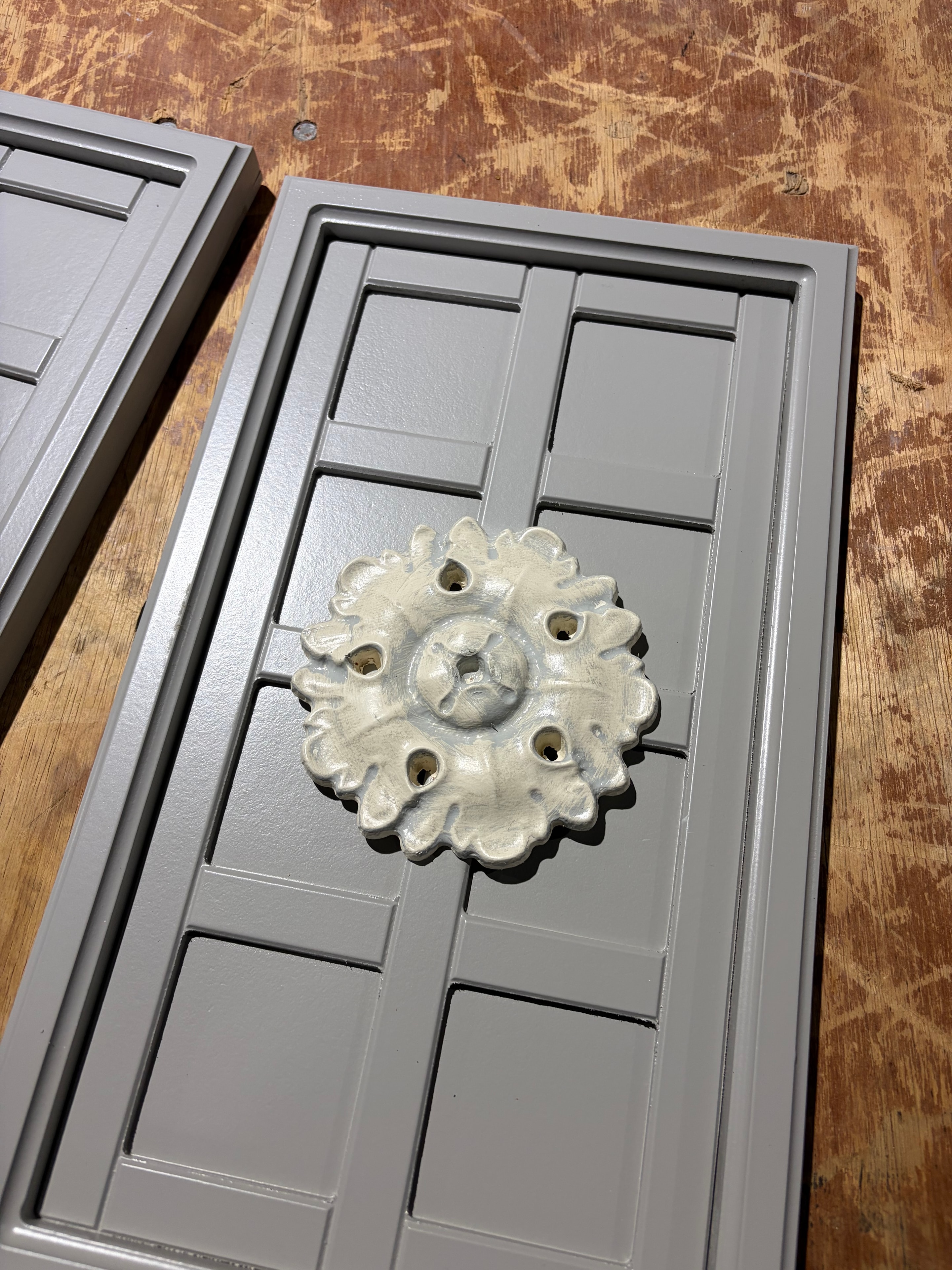 Ornamental rosette detail on a fabricated panel — Buffalo Form craftsmanship